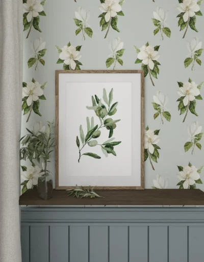 Wall arrangement with magnolia wallpaper and olive poster